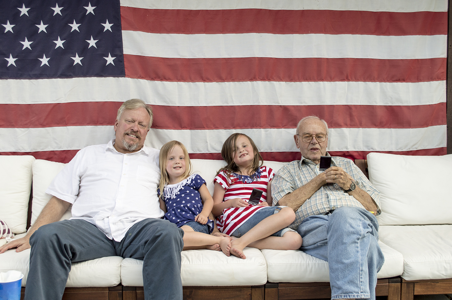 Grandpa Ed, Penny, Abbey and Grandpa Dutch relax after our BBQ. 