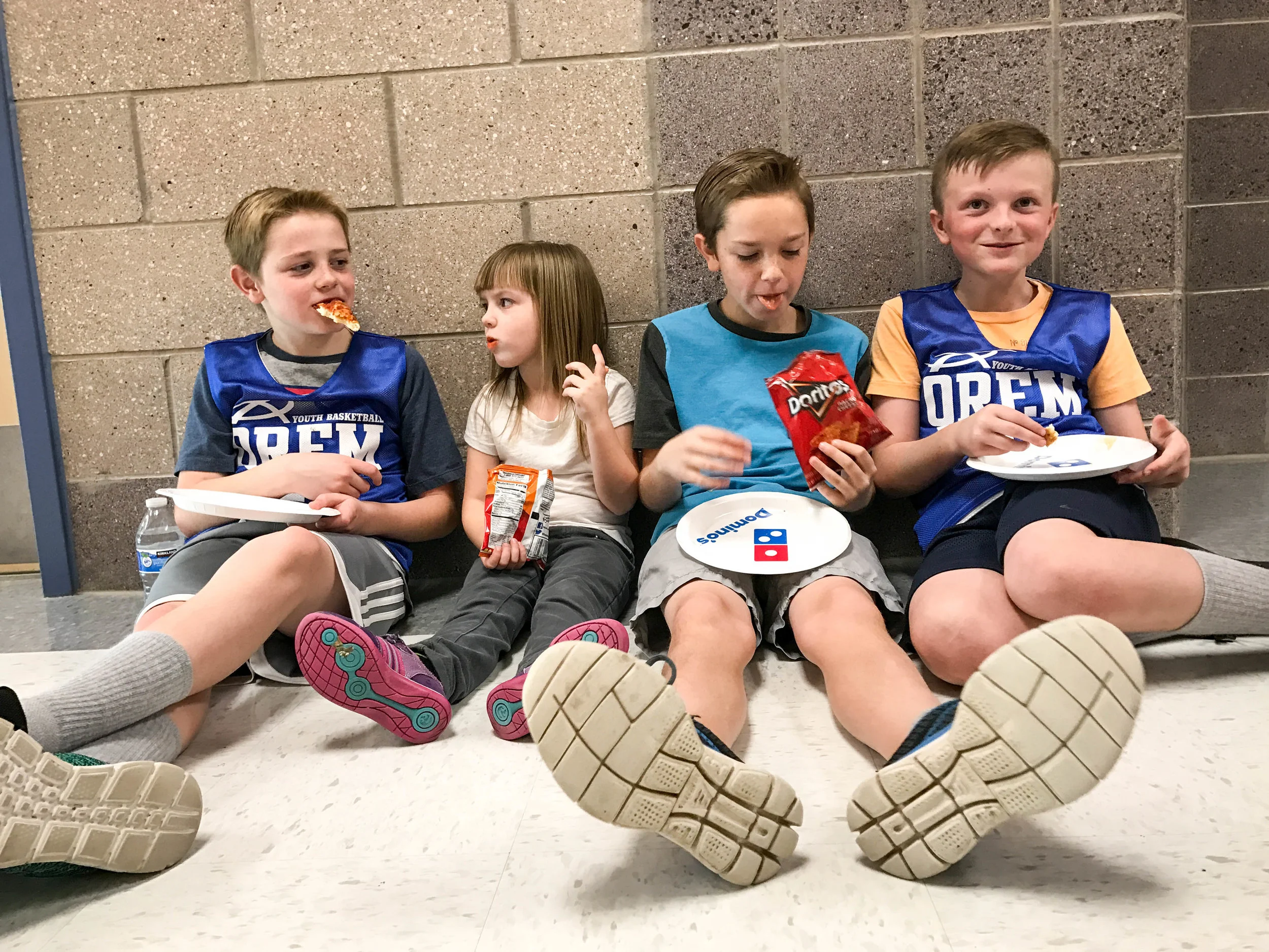 The Willis' (Tau's parents) were kind enough to throw a pizza party after the game. This is Jude and his buddies hanging out and eating pizza. Left to right: Cooper, Rylee, Jackson and Jude.