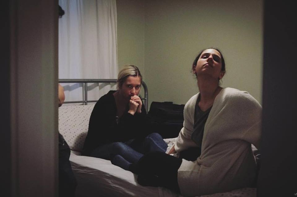 Jamie and Sarah getting notes from Joel between takes 