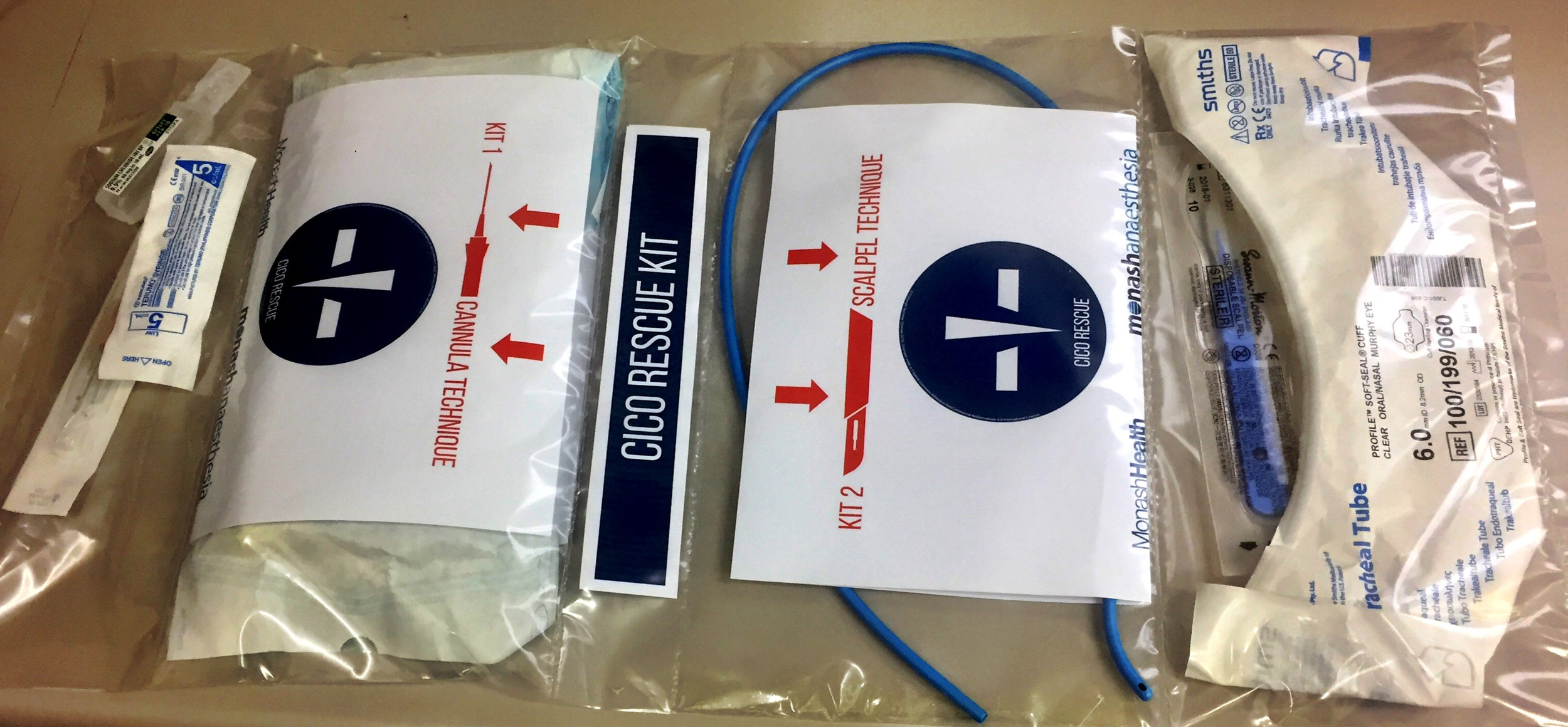 Monash Health (Melbourne, Australia) CICO Rescue Kit Cannula Kit Contents: 14G Insyte cannula, 5ml syringe, 10ml 0.9% Saline, Rapid O2 insufflation device. Scalpel Kit: Size 10 broad blade disposable scalpel, Size 6.0 cuffed ETT, Frova intubating catheter, Cook 15mm Rapifit adaptor. Additional: Restock instructions