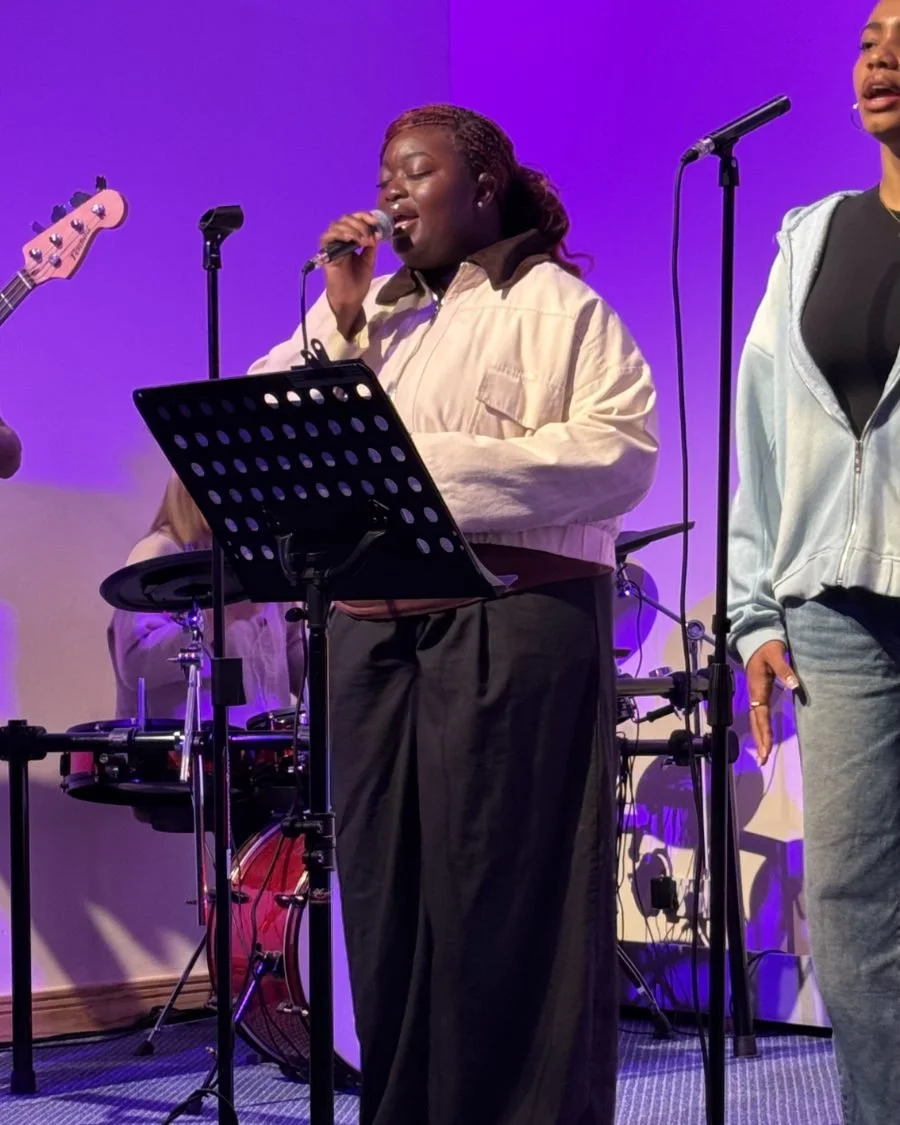 Singers rehearsing with the worship team