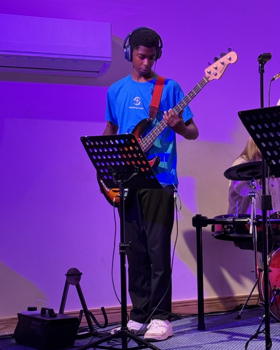 A bass player in the worship band