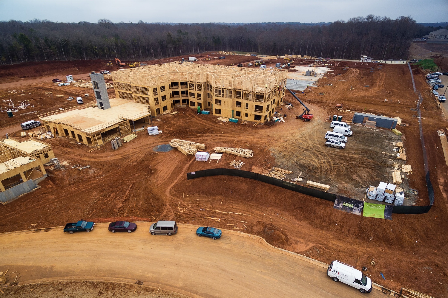 framing is well under way on a building in the crescent communities' providence farm