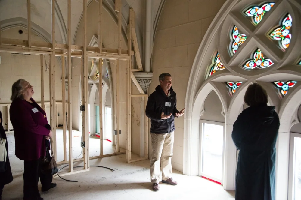 Developer Jon Chorlian leads tours through the Sacred Heart Church on Pleasant Street, which was being converted into condo units. Photo: Steve Booth