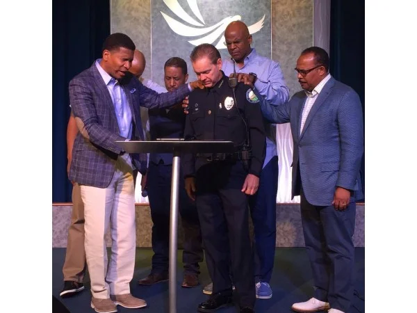 African-American faith leaders praying for Roswell's police chief and department.