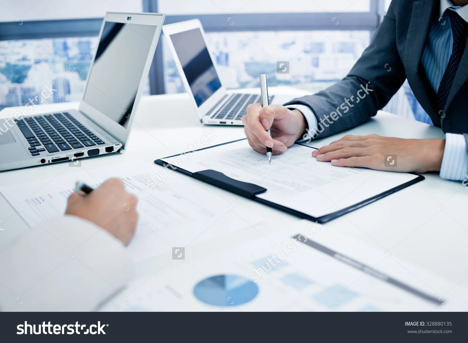 stock-photo-business-people-discussing-the-charts-and-graphs-showing-the-results-of-their-successful-teamwork-328880135.jpg