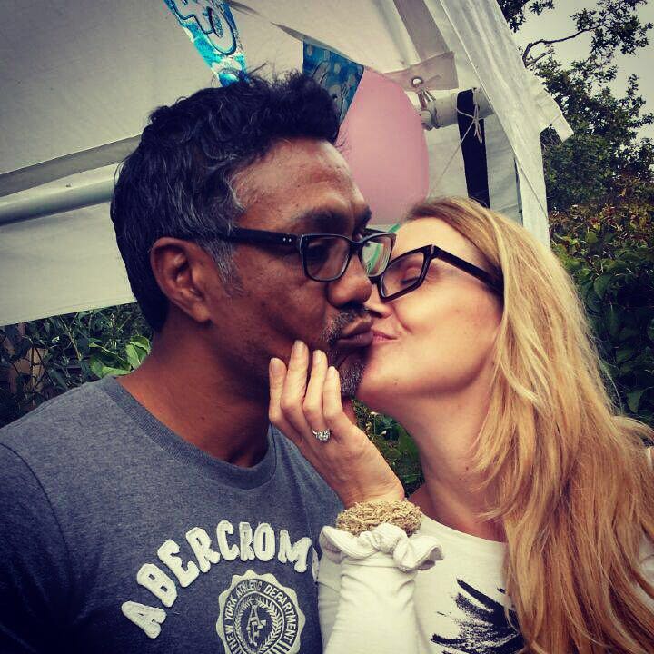 Kevin shares a kiss with his fiancée, Zoe Floyd.