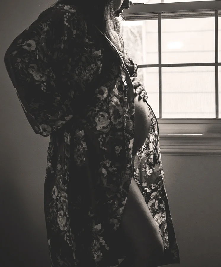 This was at 35 weeks, I was huge but my pose along with the drape of the kimono helped to create a more slimming effect. Black and white helps as well.