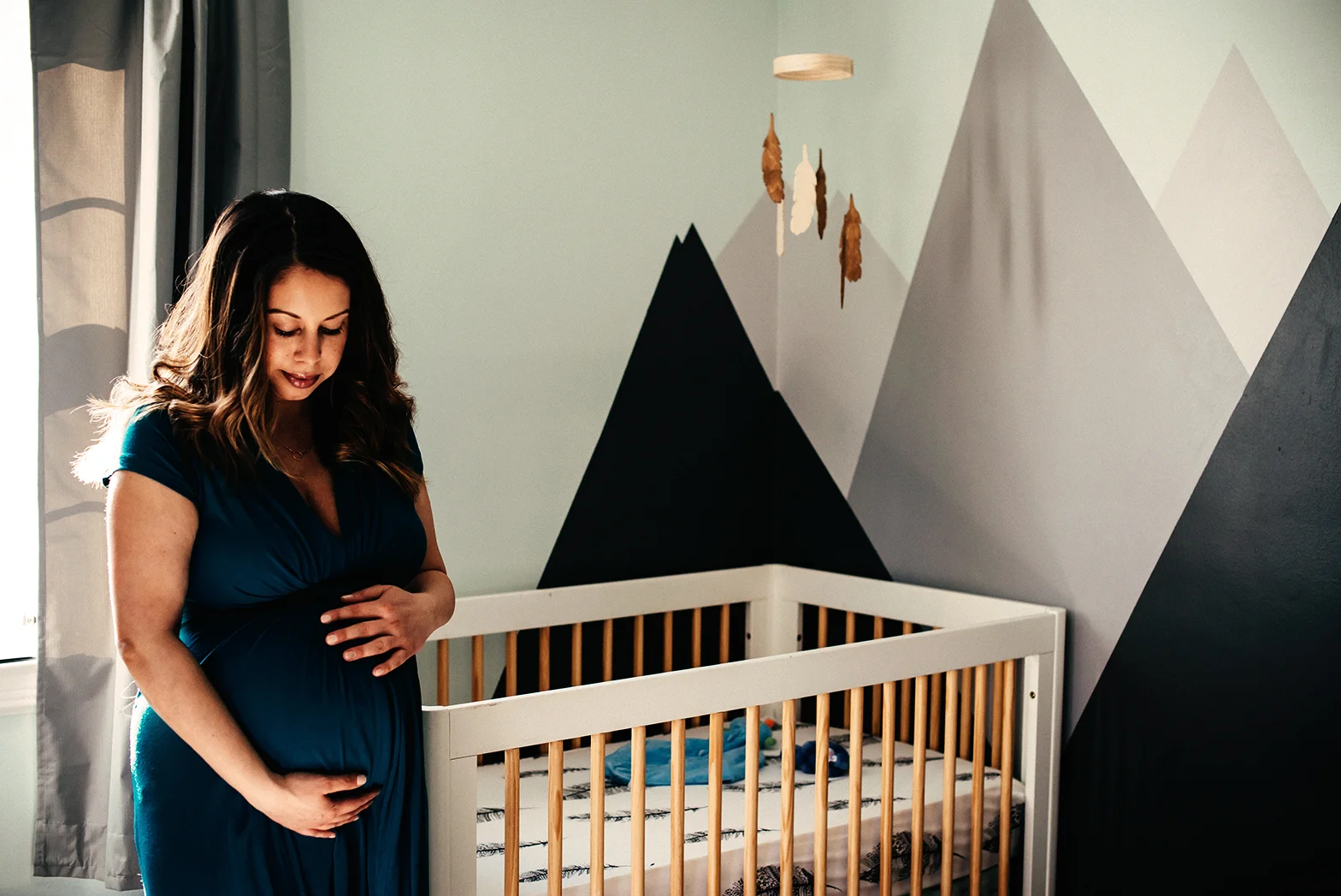 this was about a week before I had Fletcher in his newly completed nursery. My husband painted the mountains on the wall :)