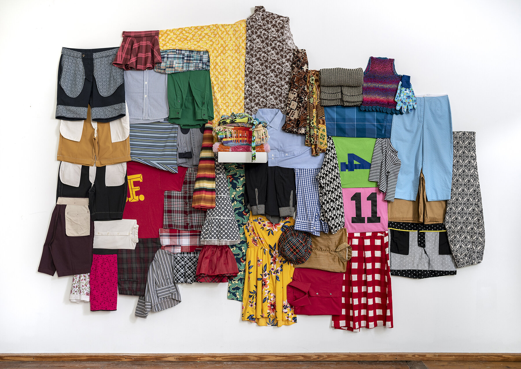   First Heave  Reclaimed garments, shelf, pins 80 x 120 x 12” Produced with the support of the Pollock - Krasner Foundation 2019 
