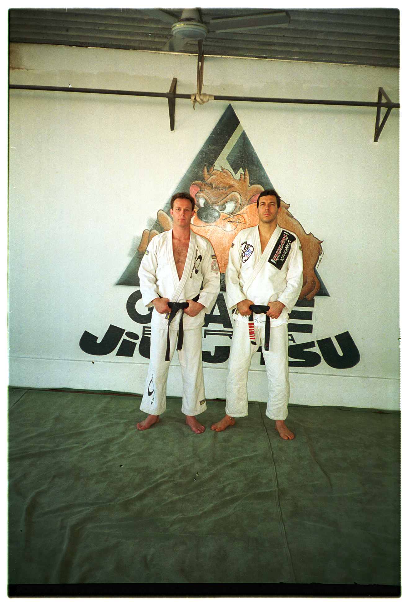 Pete and Carlinhos at the original Gracie Barra Academy, Rio de Janeiro Brasil 1996. (Check out the mats!)