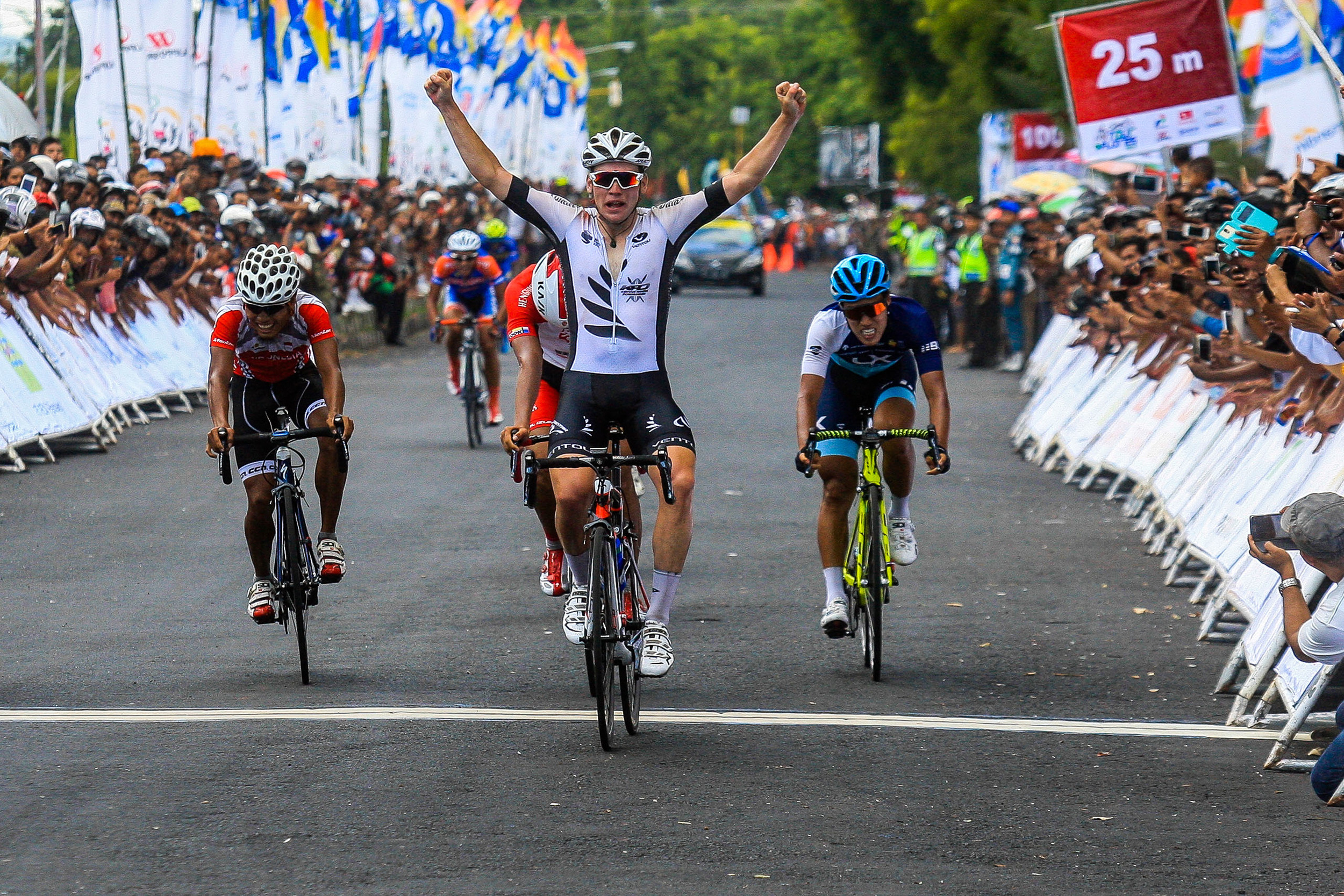 Jason Christie powers across the finish line to take stage 1. Photo courtesy of Mokhriz Aziz