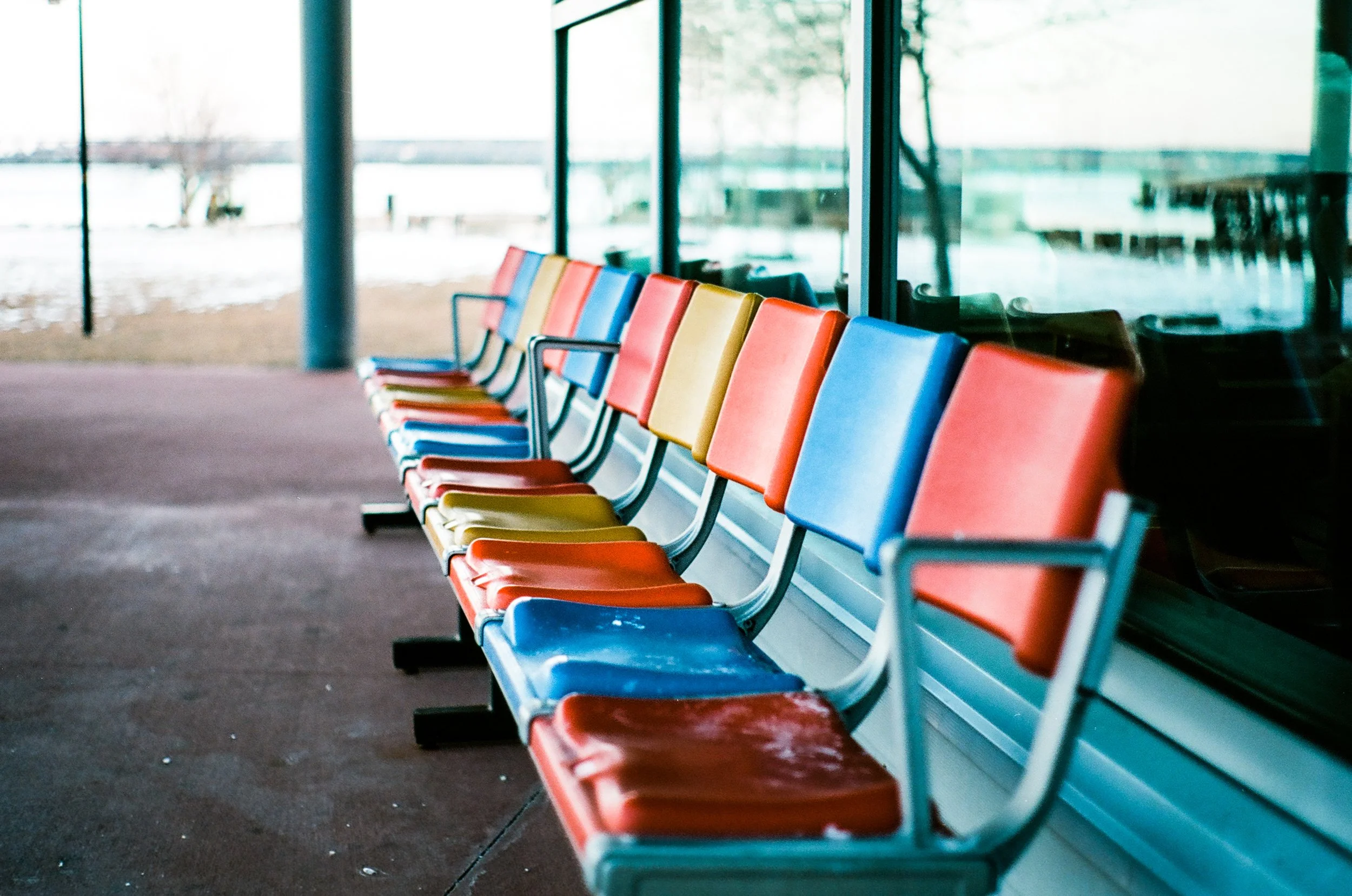 a bank of brightly colored chairs at Ocean Gateway in Portland Maine.