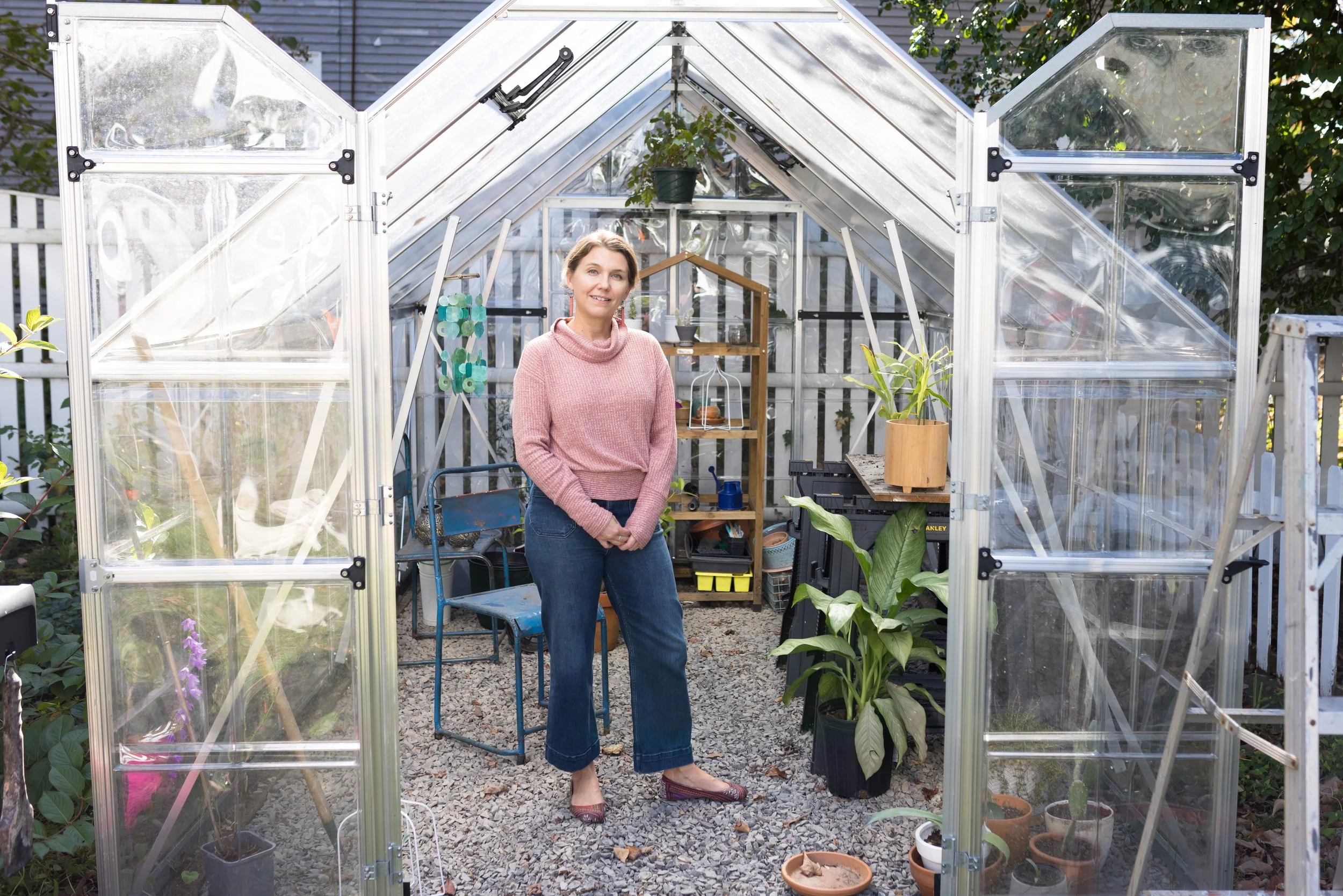 artist and graphic designer Jenny Rutherford at home in her greenhouse.
