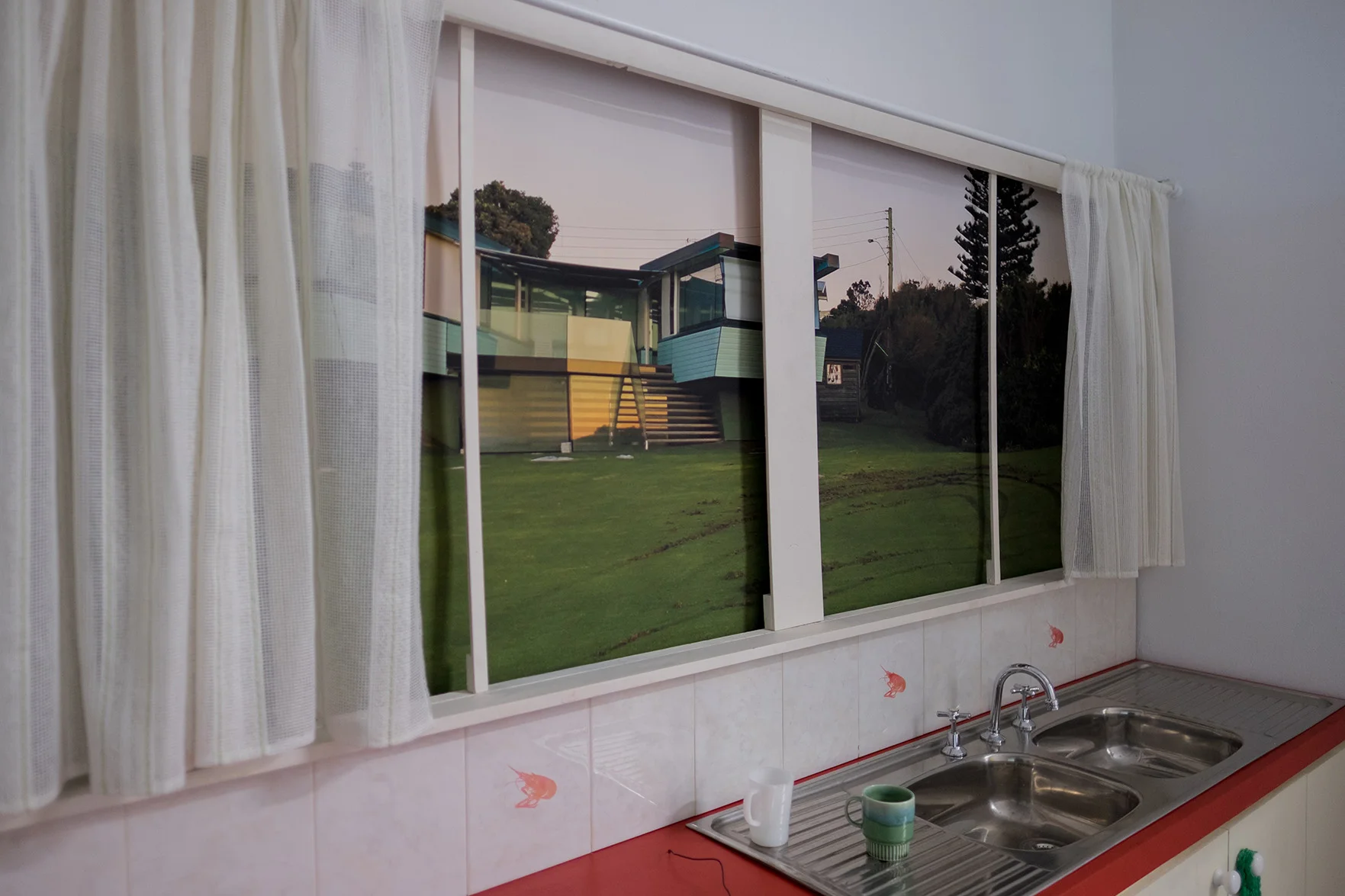 Kitchen at the Flinders House (section of kitchen with sink with window) , 2015, Theatre Set “Quirky beach house competing for a prize” 19 th June 2015. / “Corrections and Clarifications: The project was approved by councilors in 2012 who overturned the advice of planning staff.” 26 th June 2015, 2015, Photograph taken 27 th of June 2015, large format print