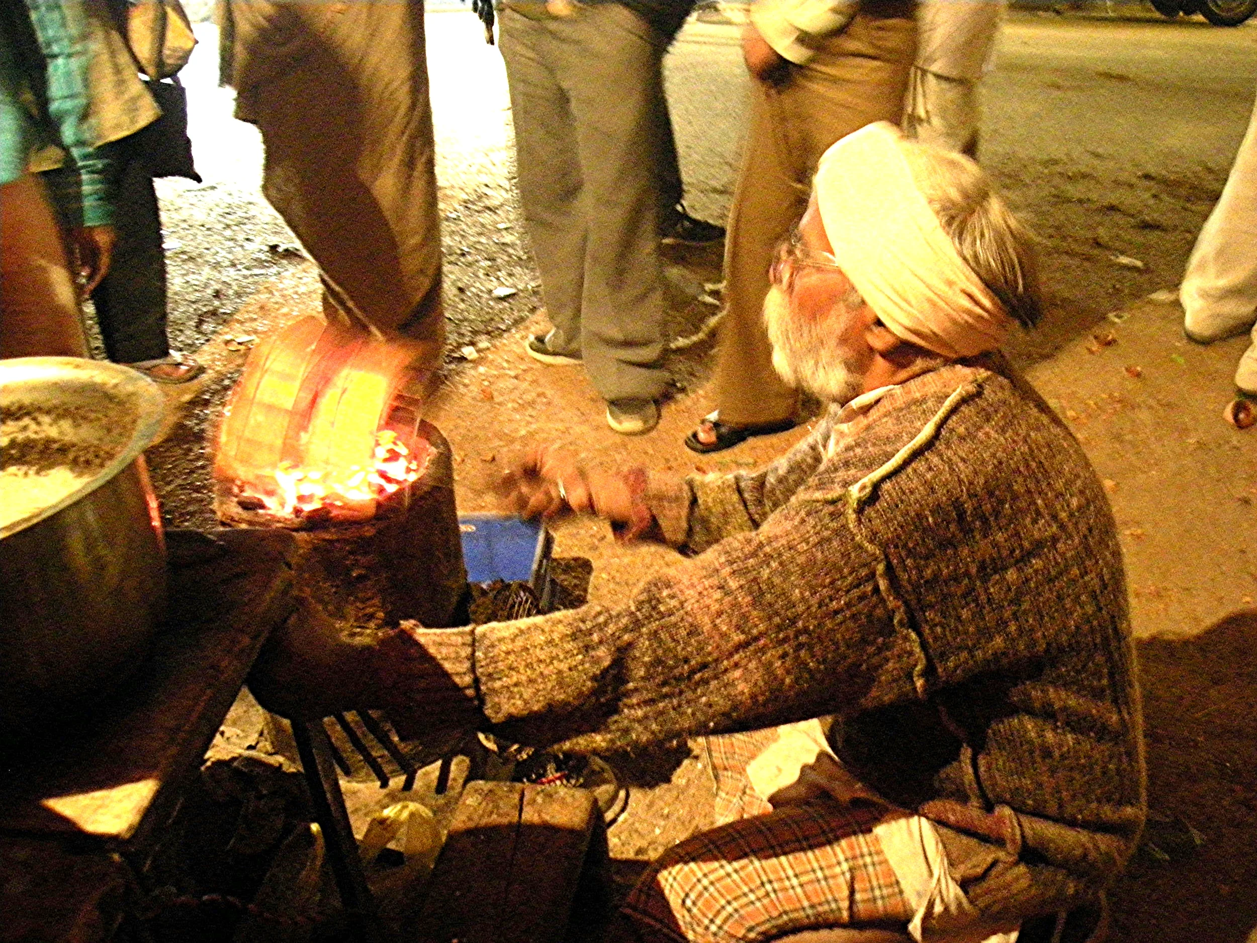Man making toast on the streets of Varanasi