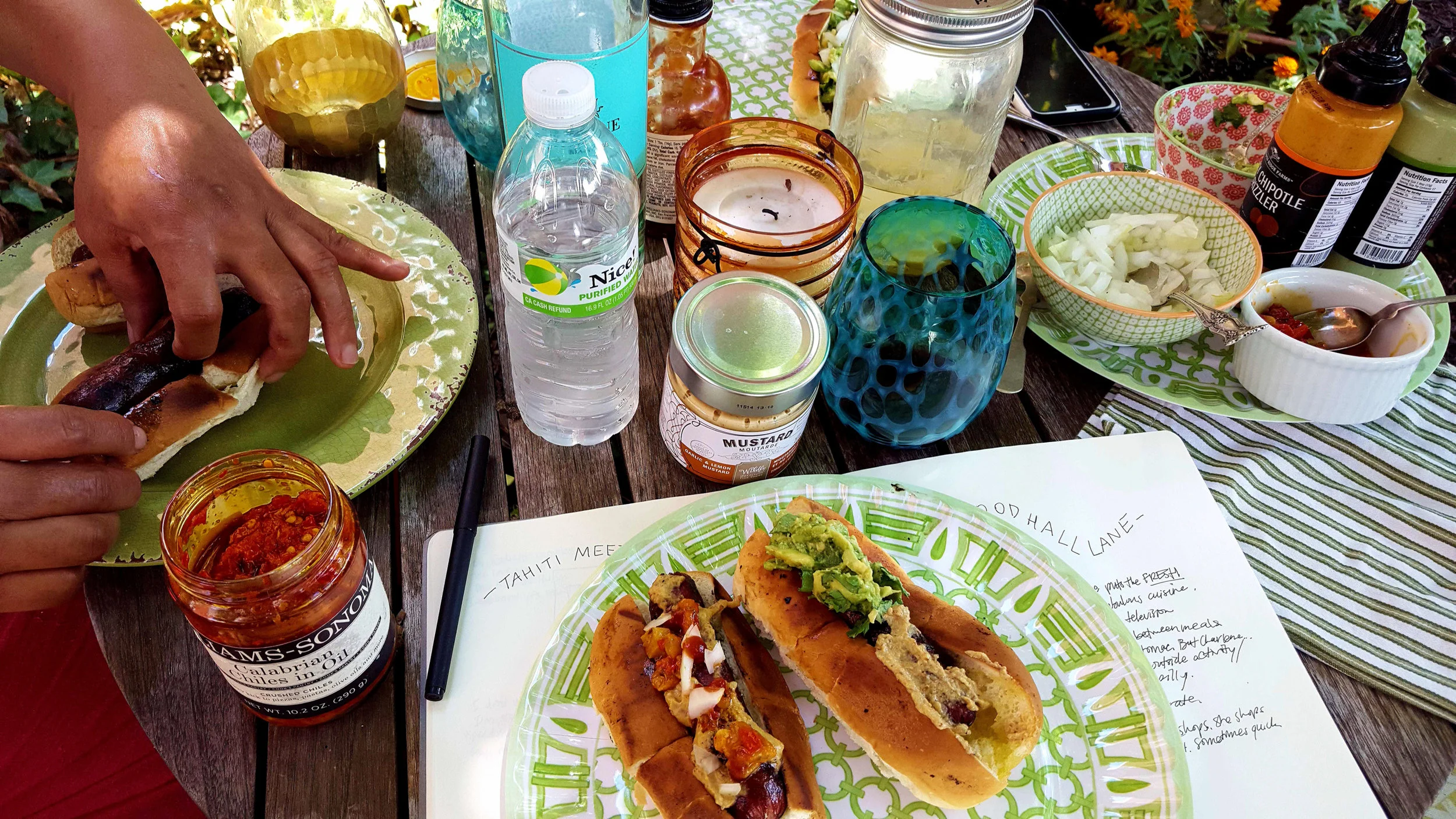 Hot dog bar with assorted fixings. With the hot dog bar everyone can make their own dogs the way they like them and even mix fun flavors together like avocado and mustard!