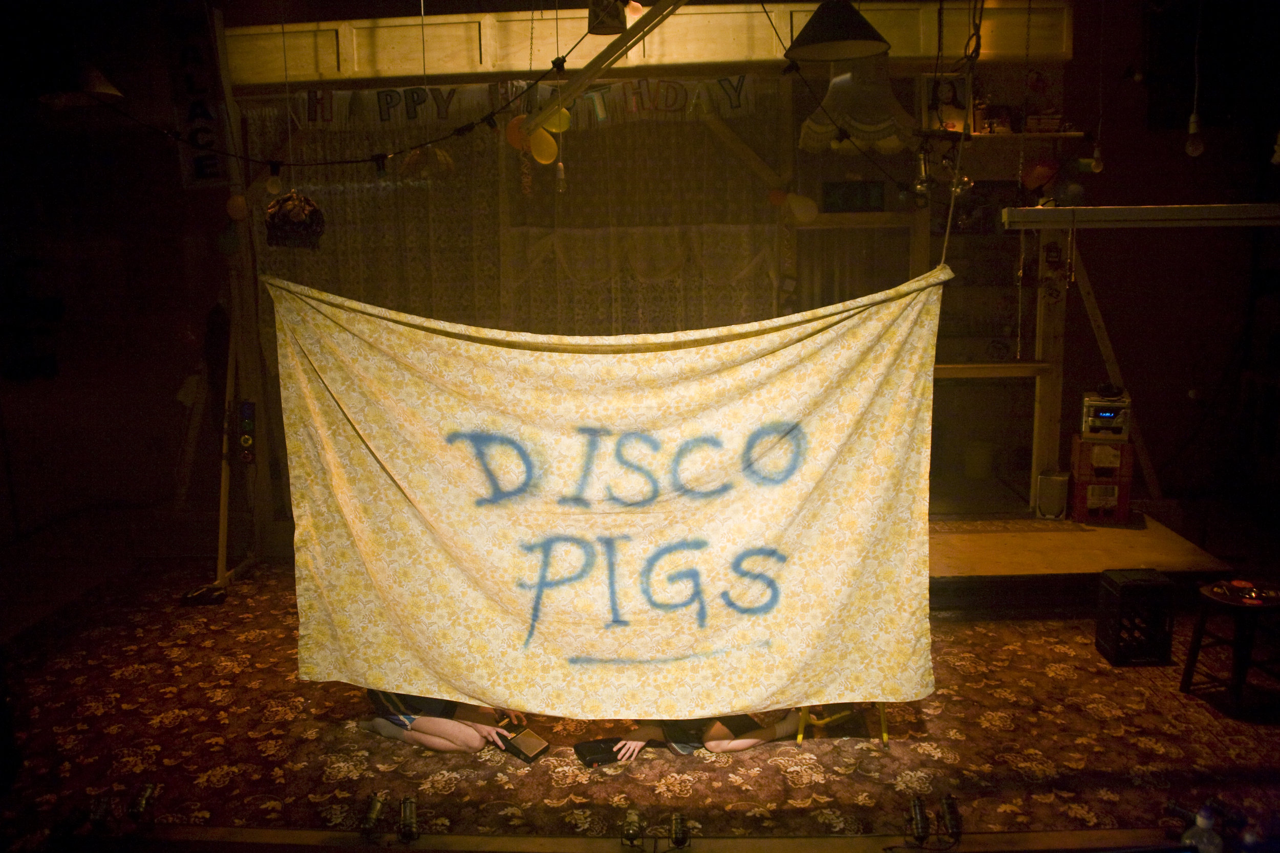   Disco Pigs /  Young Vic / September 2011   JMK DIRECTORS’ AWARD WINNER   Written by  Enda Walsh   Designed by  Chloe Lamford   Lighting by  Anna Watson   Sound by  Tom Gibbons   Assistant Director  Ola Ince   Produced by  Ros Terry   Cast  Charlie 
