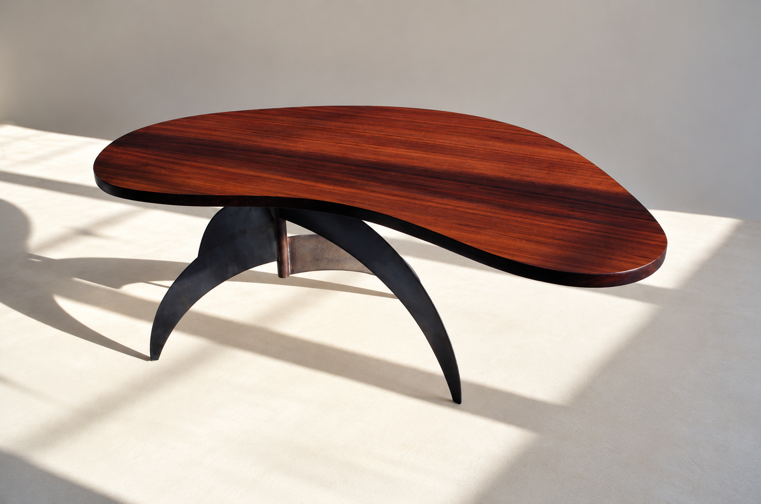 Sculptural Walnut Table in Sunlight.png