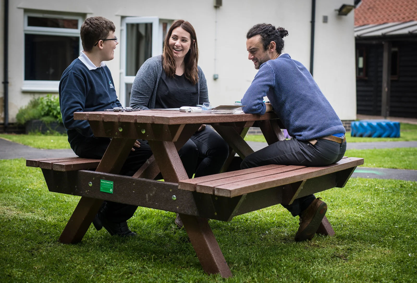 A student and staff taking their lesson outside