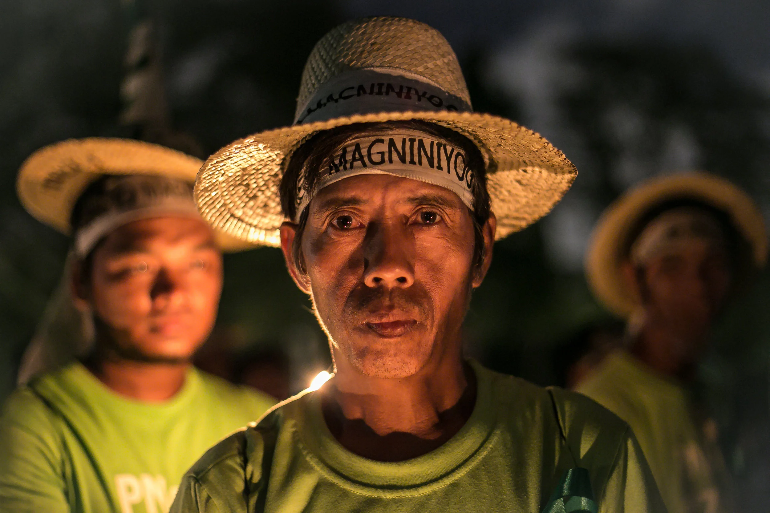 The coconut farmers of the KM71 Martsa ng Magniniyog for the establishment of P71 B Coco Levy Trust Fund ends their day's march at the Ateneo de Manila University (ADMU) with a prayer vigil held by the Ateneo community on 20 November 2014