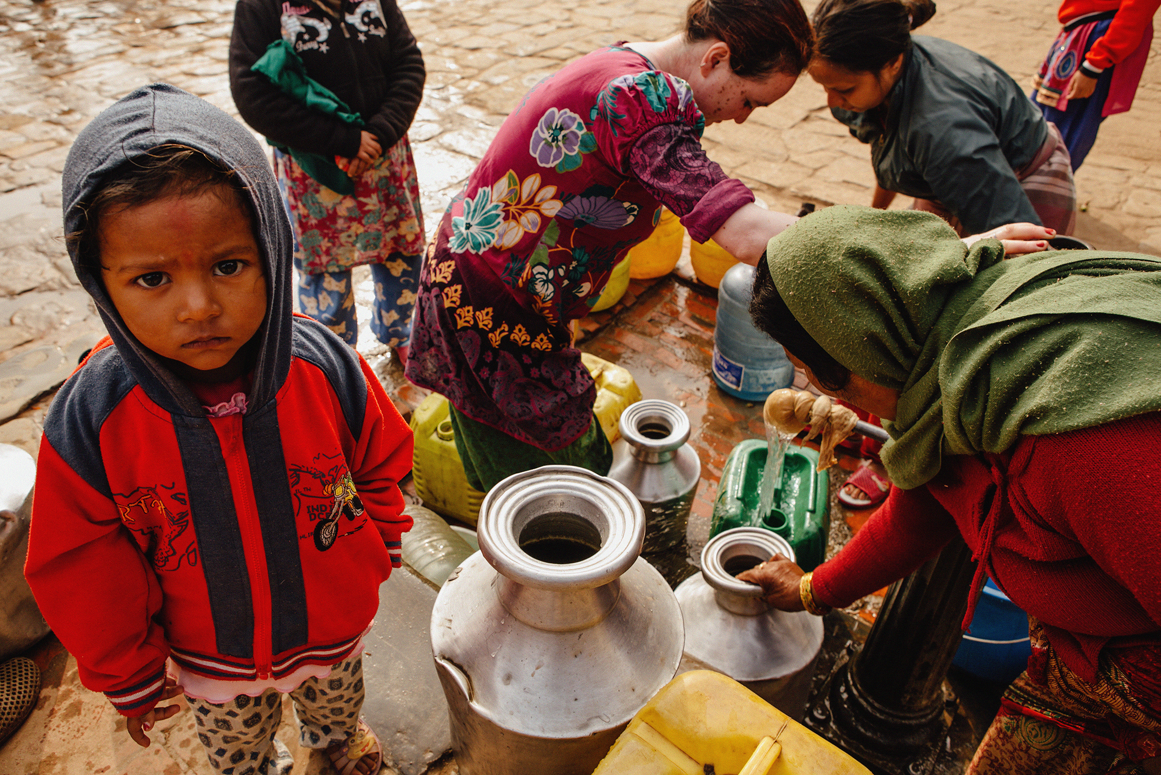 BHAKTAPUR, NEPAL — Women gather around a driven well in Bhaktapur where source for water is limited.