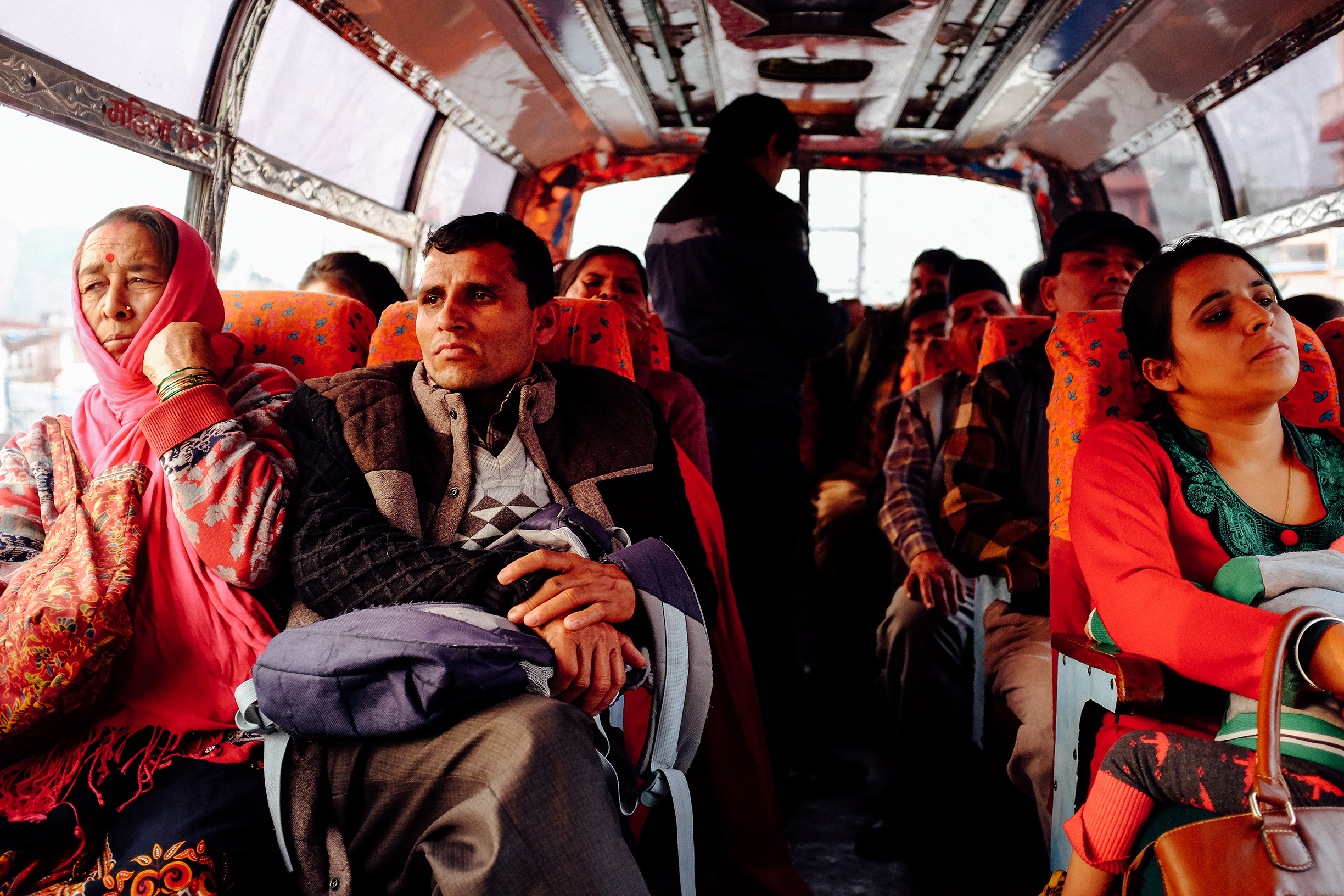 POKHARA, NEPAL — Commuters aboard a public bus in Pokhara after a day's work.