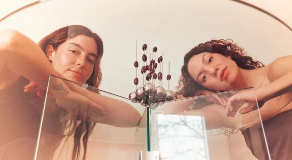 Elena Petrossian and Verónica González of Ananas Ananas, pictured with an object from their tableware collection (a serving dish with olives). Sela Shiloni/WWD