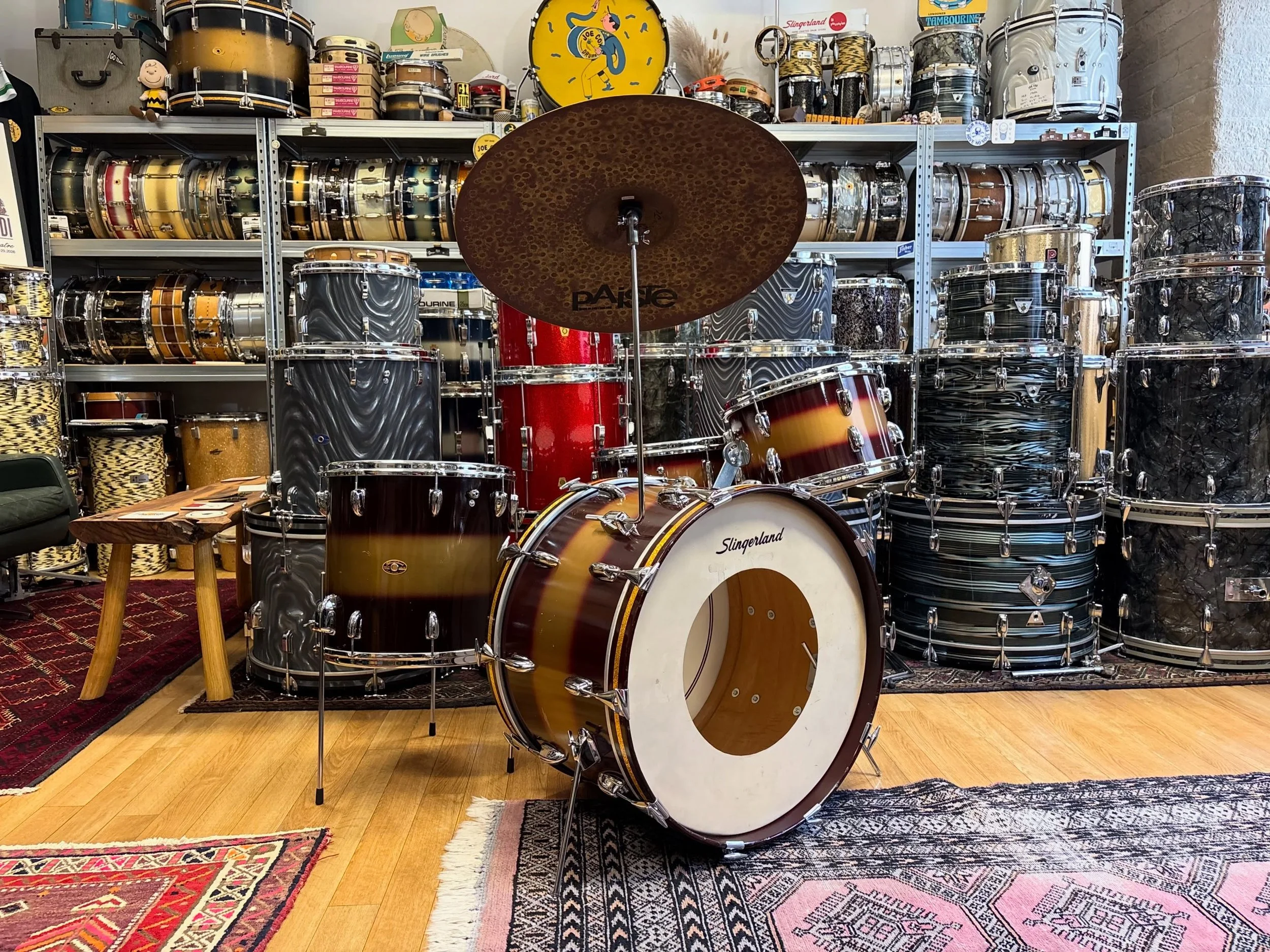 1965/66 Slingerland 22x14&rdquo;, 12x8&rdquo;, 14x14&rdquo; and 14x5.5&rdquo; Deluxe Student Model snare in original Maroon and Gold Lacquer. 

3-ply shells with clear maple interiors. All original chrome hardware including COB tom hoops, internal da
