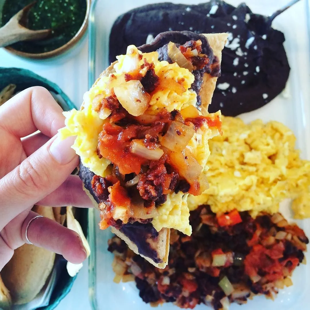 First #leftover meal of 2016! Scrambled eggs (using the whole egg), puréed black beans, and sautéed onions, tomato, and a little chorizo (just to give it that extra kick.. Oopps). Green salsa and totopos on the side. #proteinforbreakfast #protein #leftovers #fastbreakfast #loveMexicanfood #mexicanfood #healthytravels #cancun #bushwicknutrition http://ift.tt/1mql4Q2