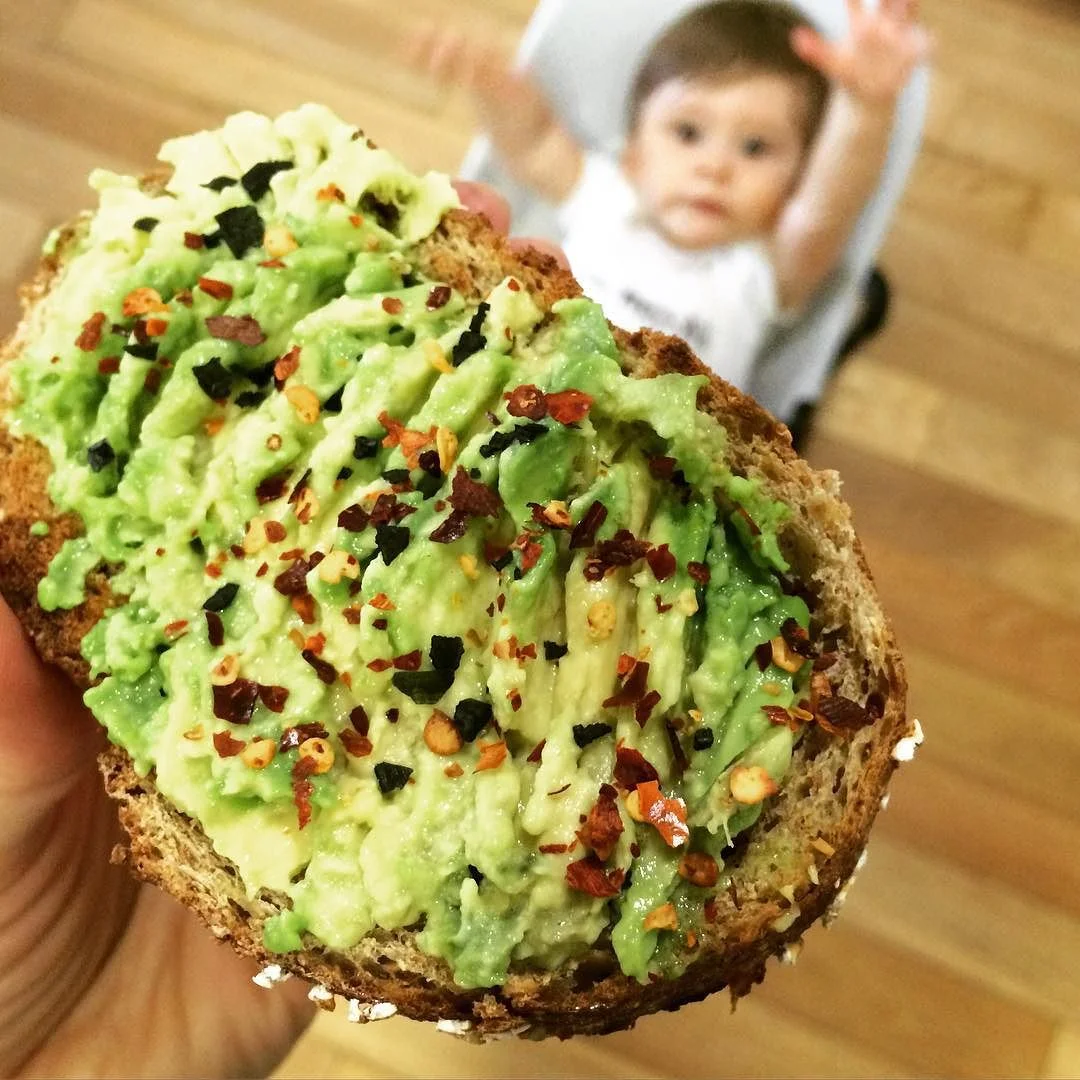 Pre-brunch #snack: #avocadotoast with #crushedredpepper flakes and #blackseasalt. Fresh bread from @bushwickbakery- by far the best fresh bread in the hood. Oh, and my son in the background jumping for joy?! #HappySaturday! #bushwick #bushwicknutrition #bushwickbakery #lazynutrition #lazynutritionist #wholegrains http://ift.tt/1NzbFep