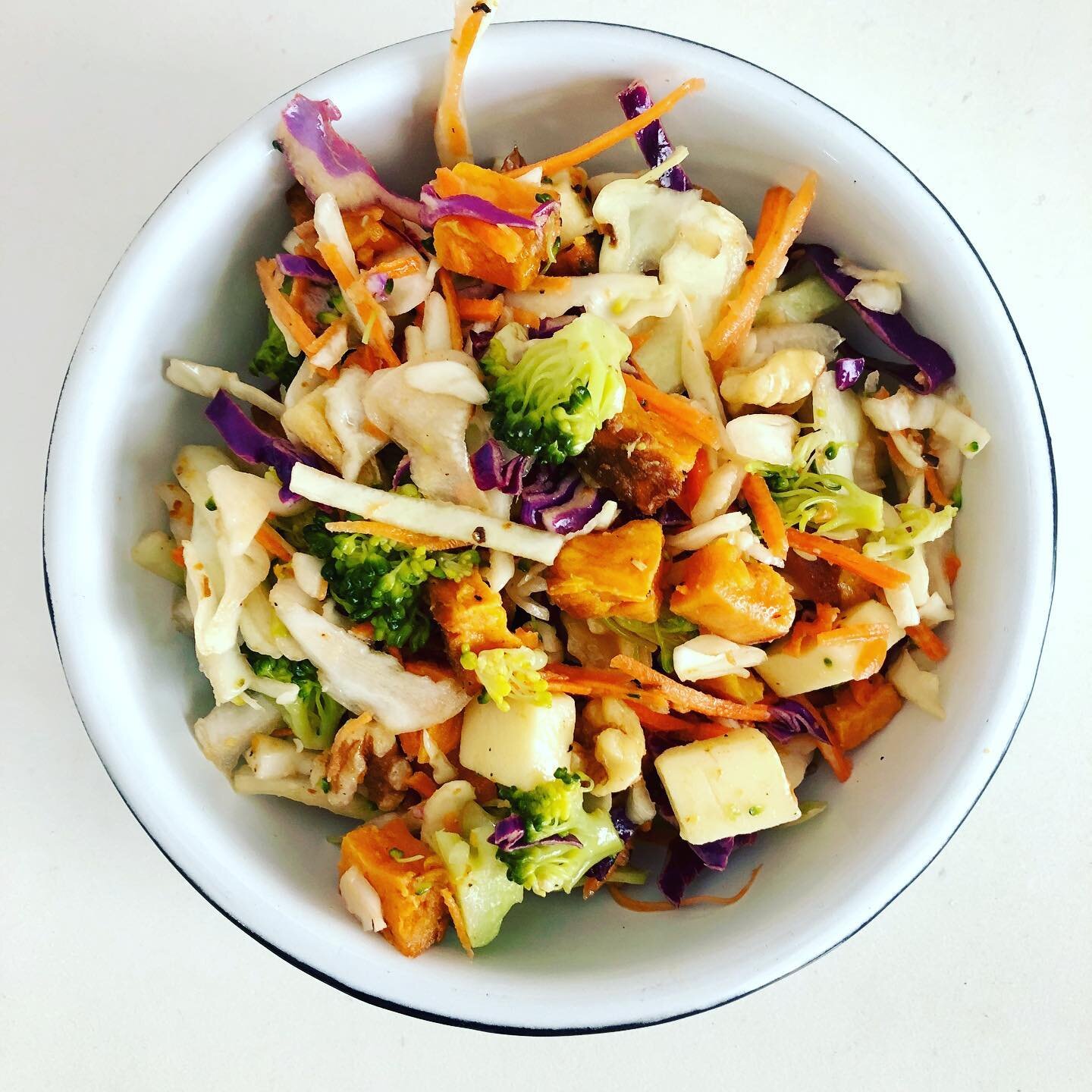 LOW FODMAP AND PORTIONS. This salad has cabbage, carrots, walnuts, cheddar, broccoli florets, sweet potato, olive oil, and red wine vinegar. It&rsquo;s low FODMAP since each food is around the threshold that most people can tolerate. 

This is probab