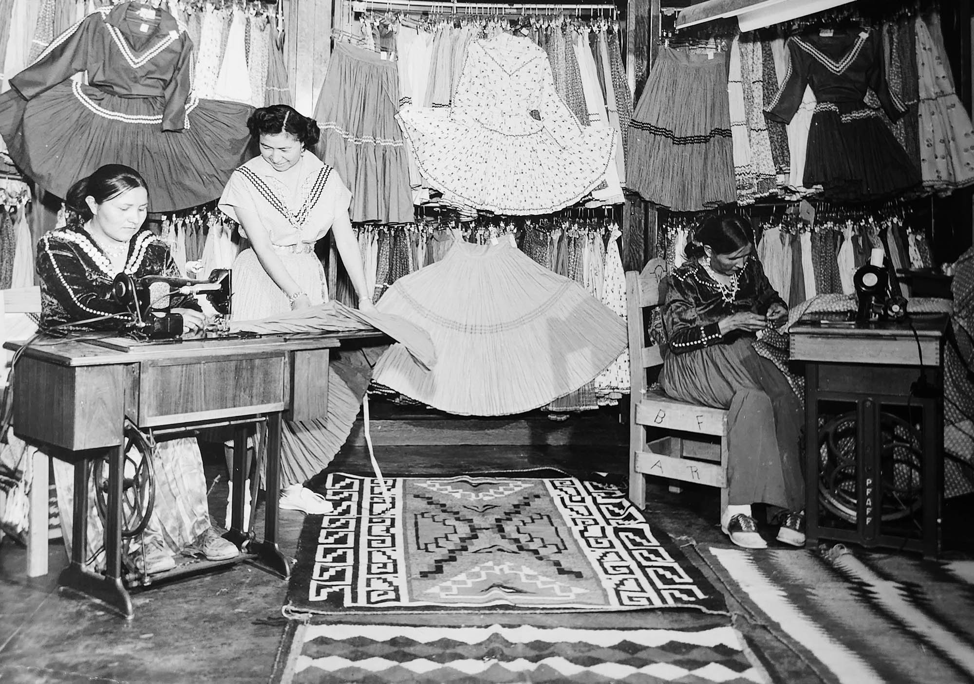 Navajo seamstresses at work sewing fiesta dresses