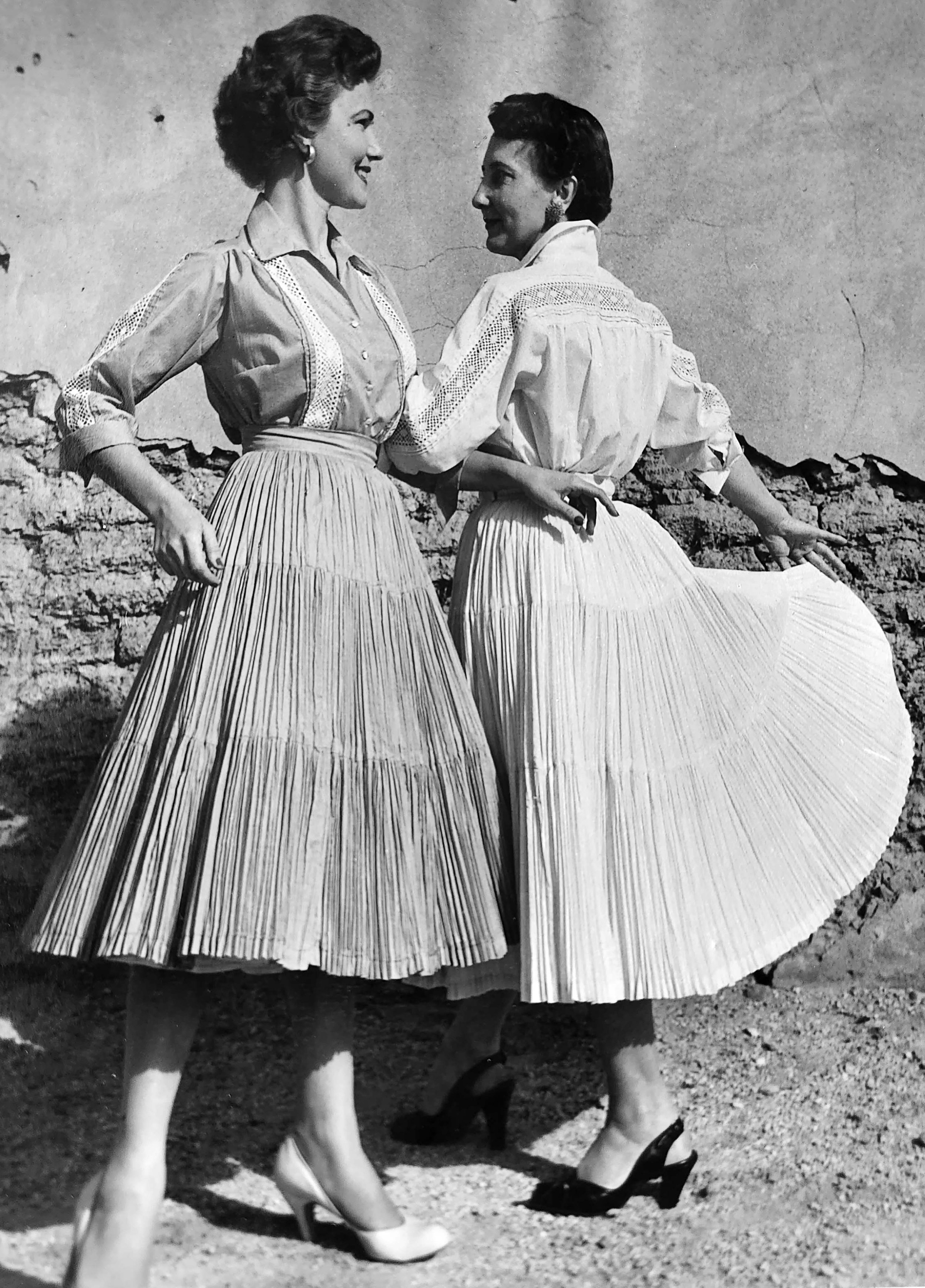 Odessa LaFont (on the right) modeling a fiesta dress