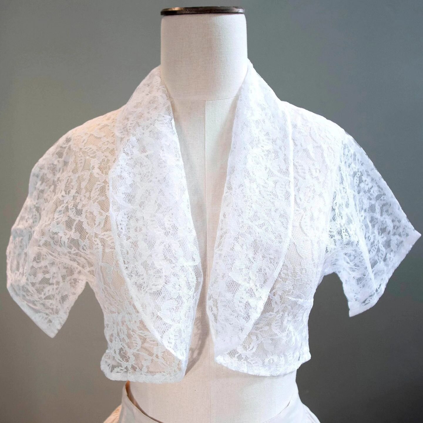 This vintage lace bolero shrug is the perfect accessory. Lightweight and airy, it's a beautiful cover up for a bridal gown, formal wear, or it can be used to dress up a casual outfit. Check it out at coralquail.etsy.com #vintageclothing #wedding jack