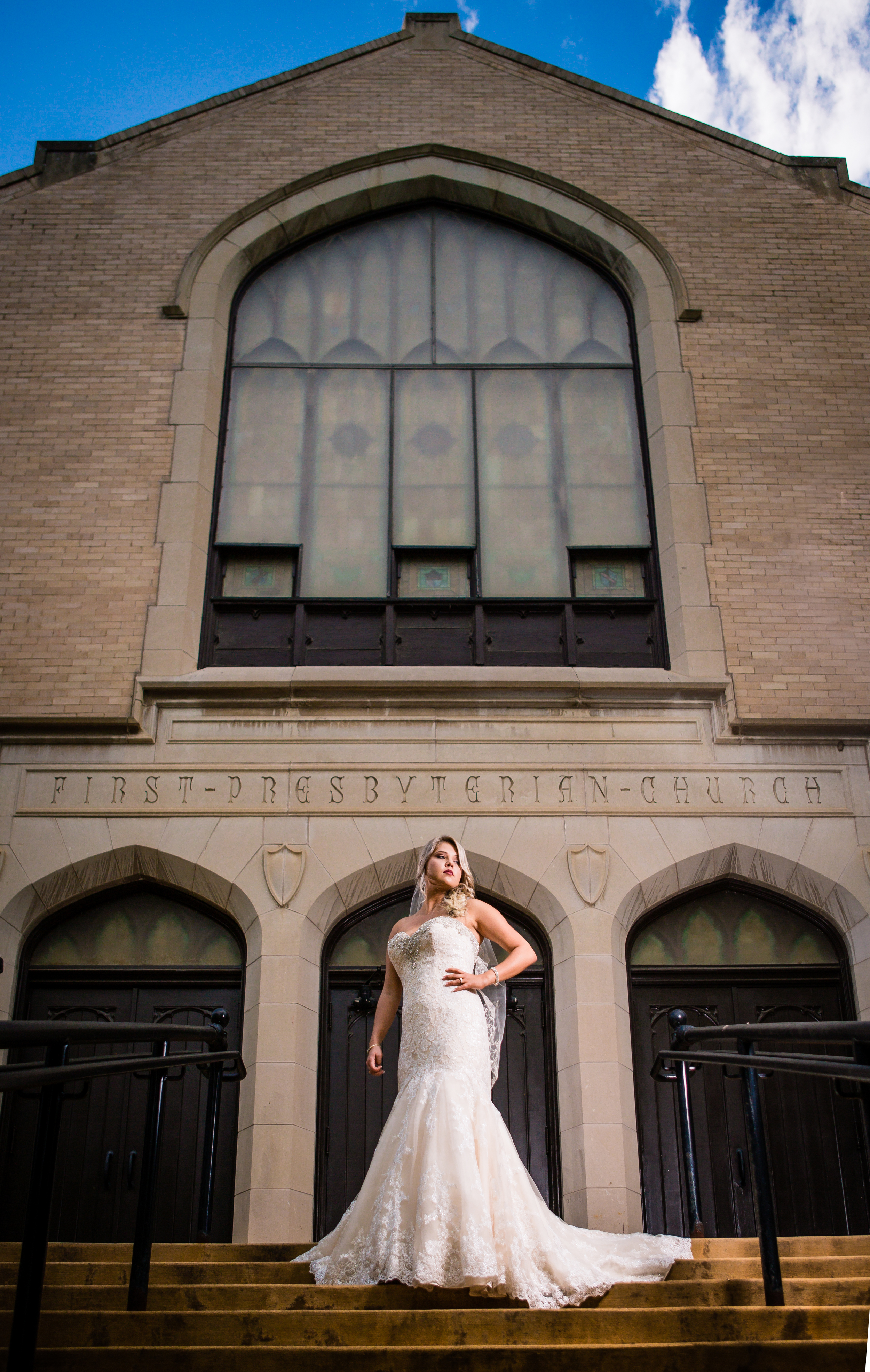 Bride standing in front of Greeley Church. www.jmgantphotography.com