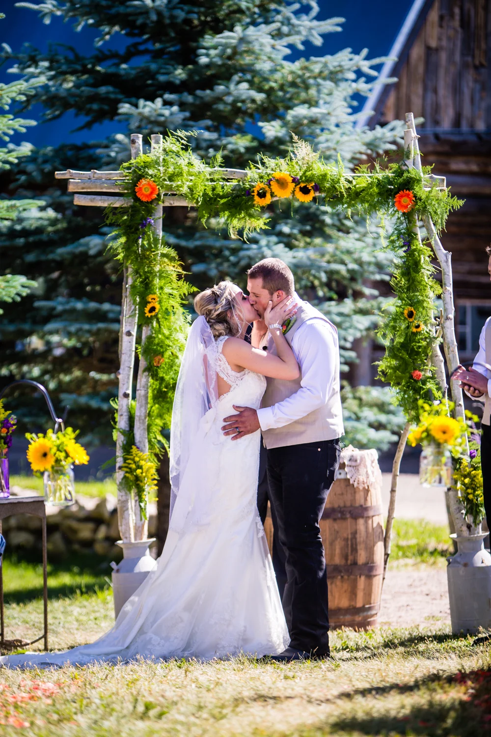 You may kiss the bride. Wedding at The barn at Evergreen Memorial. Photographed by JMGant Photography.