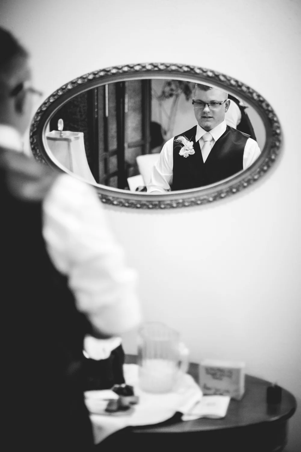 Groom getting ready. Photographed by JMGant Photography.