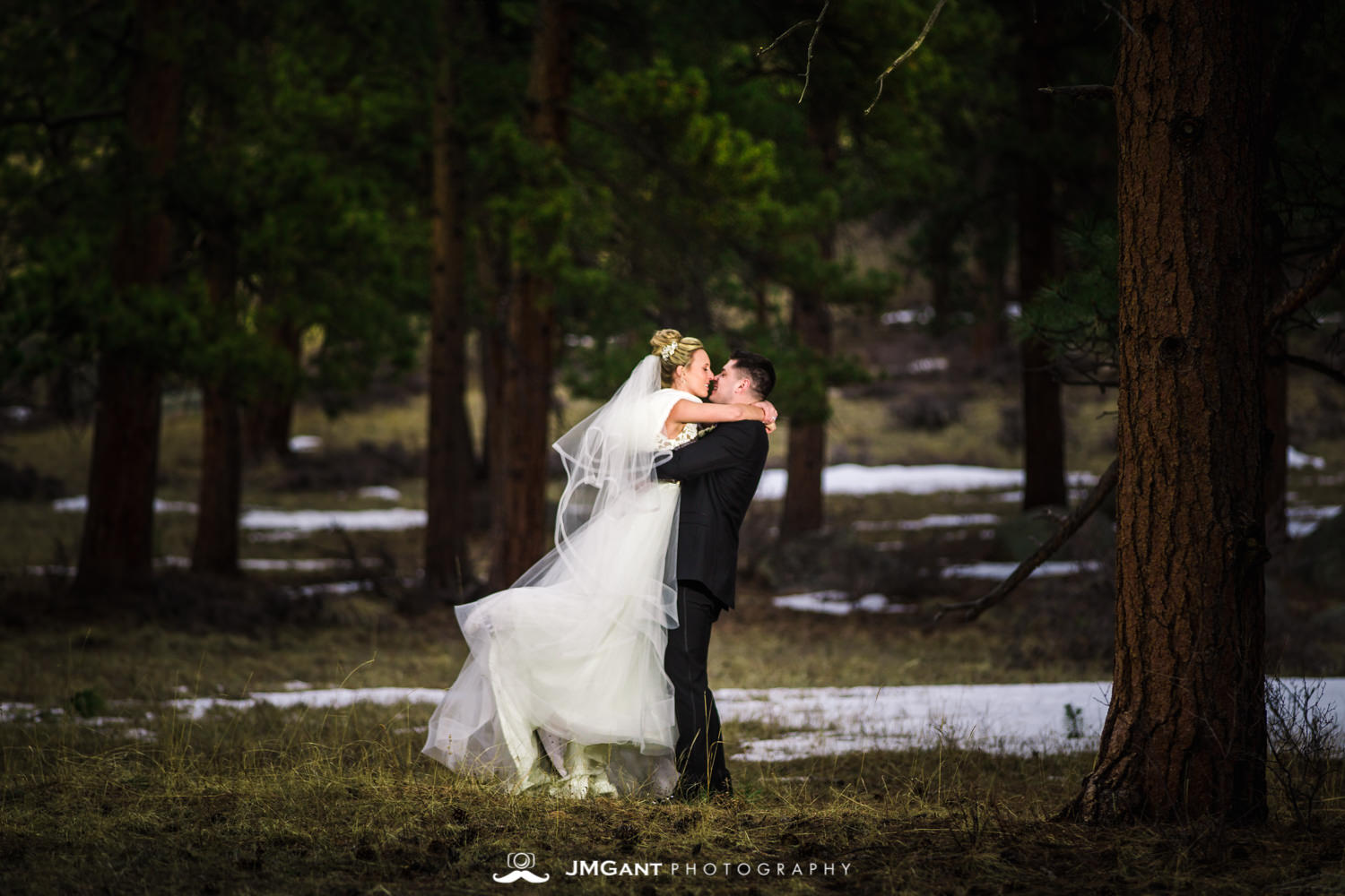 Stunning elegant wedding at the Della Terra Mountain Chateau in Estes Park Colorado. Photographed by Jared M. Gant of JMGant Photography.