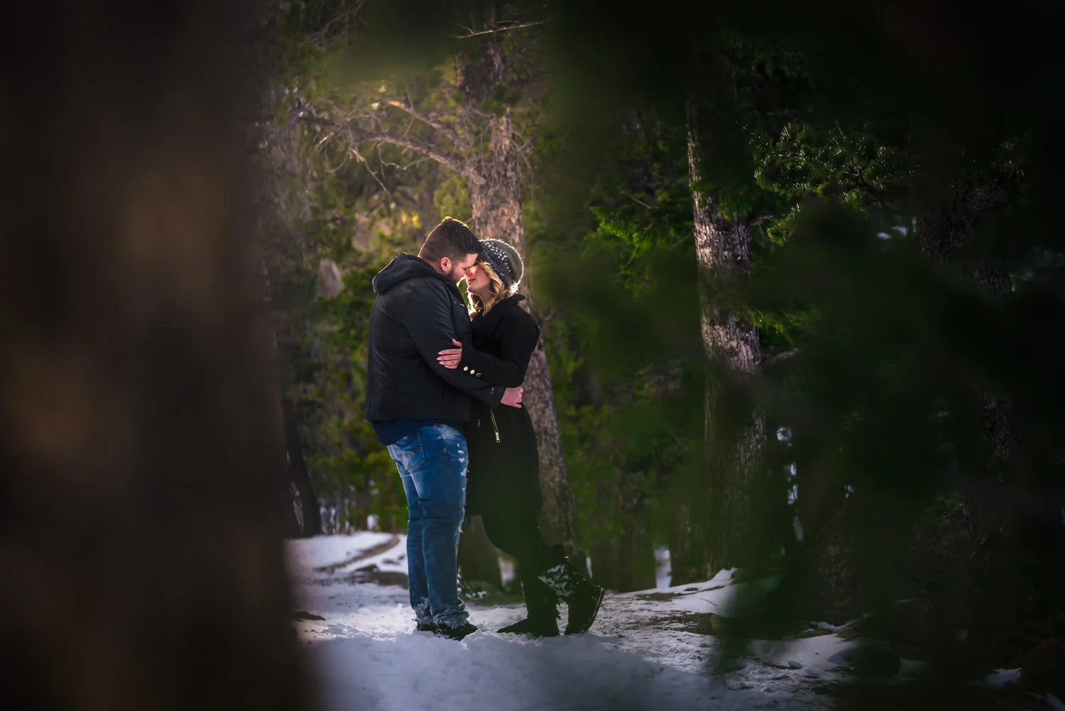 Snowy Estes Park Colorado engagement photos taken at Lily Lake in Rocky Mountain National. Photographed by JMGant Photography.