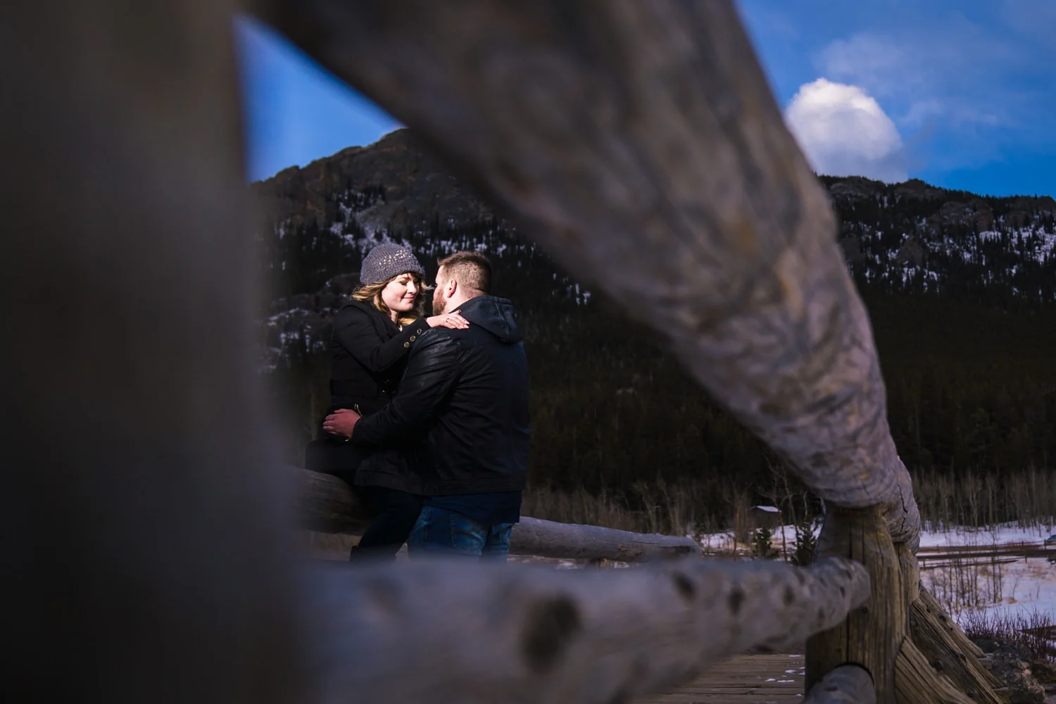 Snowy Estes Park Colorado engagement photos taken at Lily Lake in Rocky Mountain National. Photographed by JMGant Photography.