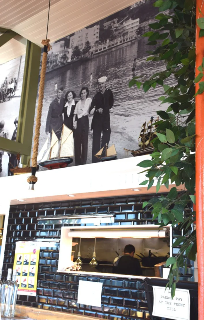 Pictures on the wall tell the history of the building
