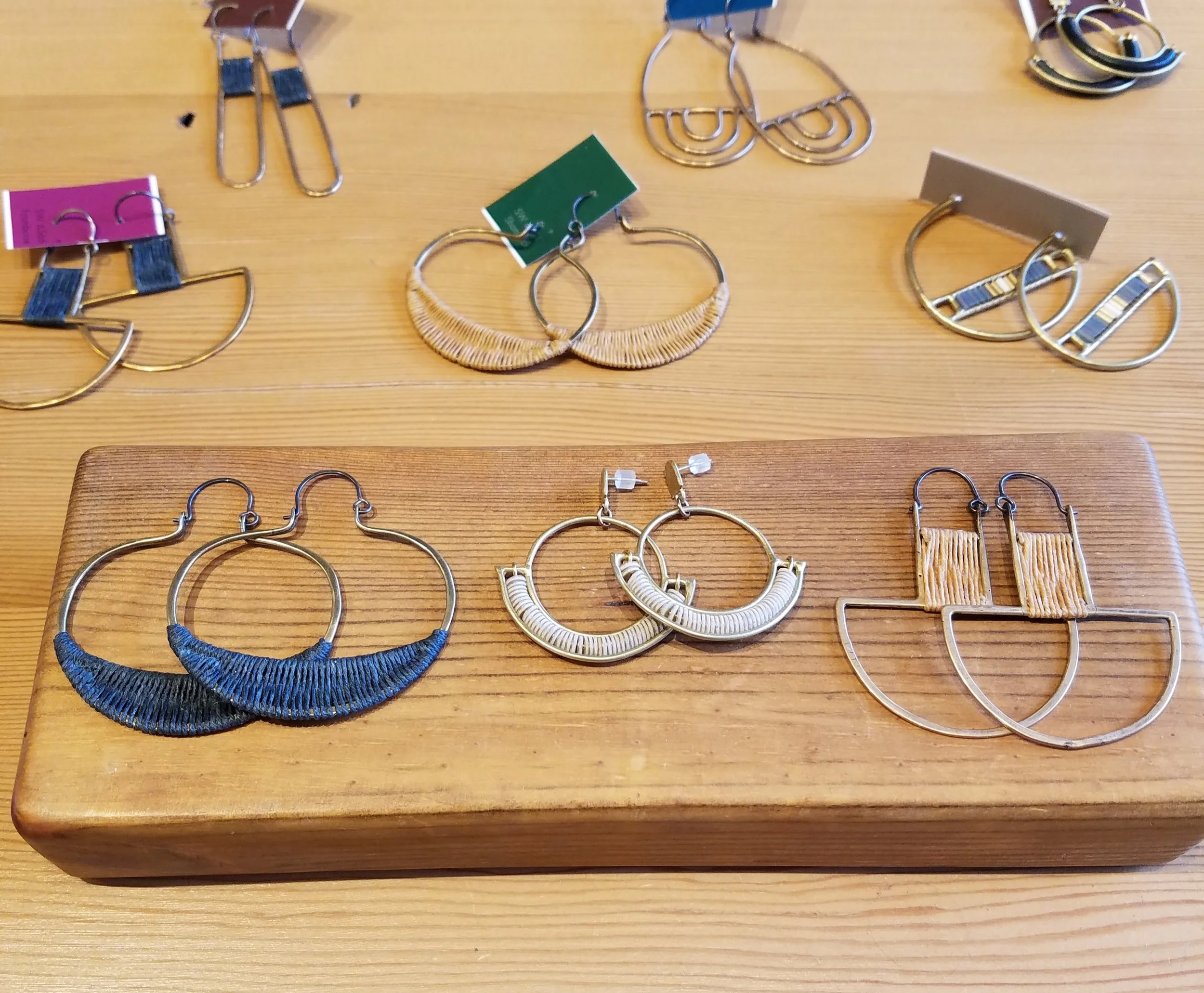 Jewelry is always a great stocking stuffer! We carry many different styles of earrings, rings, and necklaces in price ranges for any budget. *Earrings on wood block from L to R: $127, $90, $103