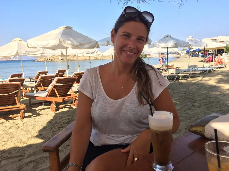 Christina drinking a Freddo (frozen) Cappucino