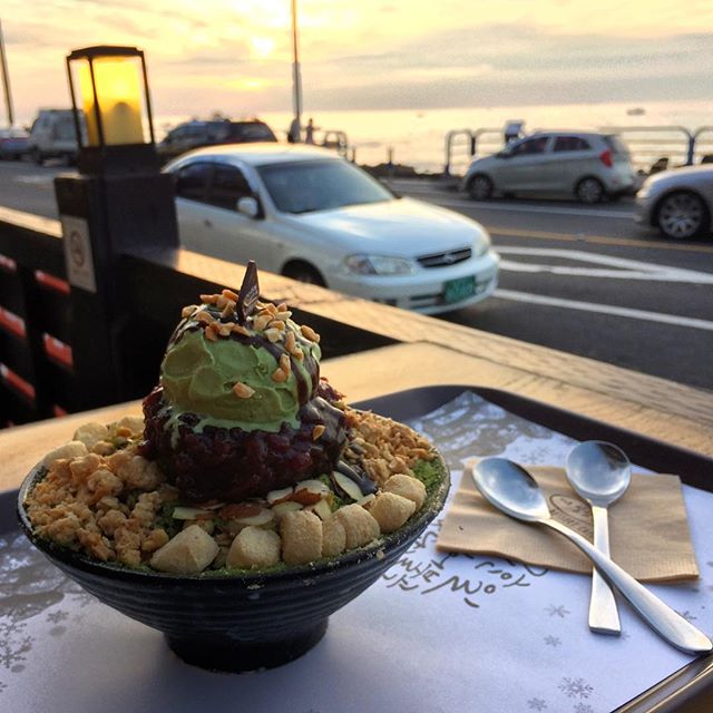 We have found the best dessert on the planet and it&rsquo;s called #bingsu 🍨 this one is green tea ice cream w/ shaved milk ice, mochi, almonds and other treats. Good God! #jeju #travel #jejuisland #korea #southkorea #koreanfood #koreandessert #inst
