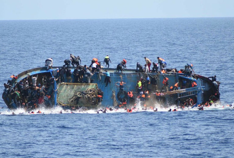 A refugee boat capsizes off the Libyan coast
