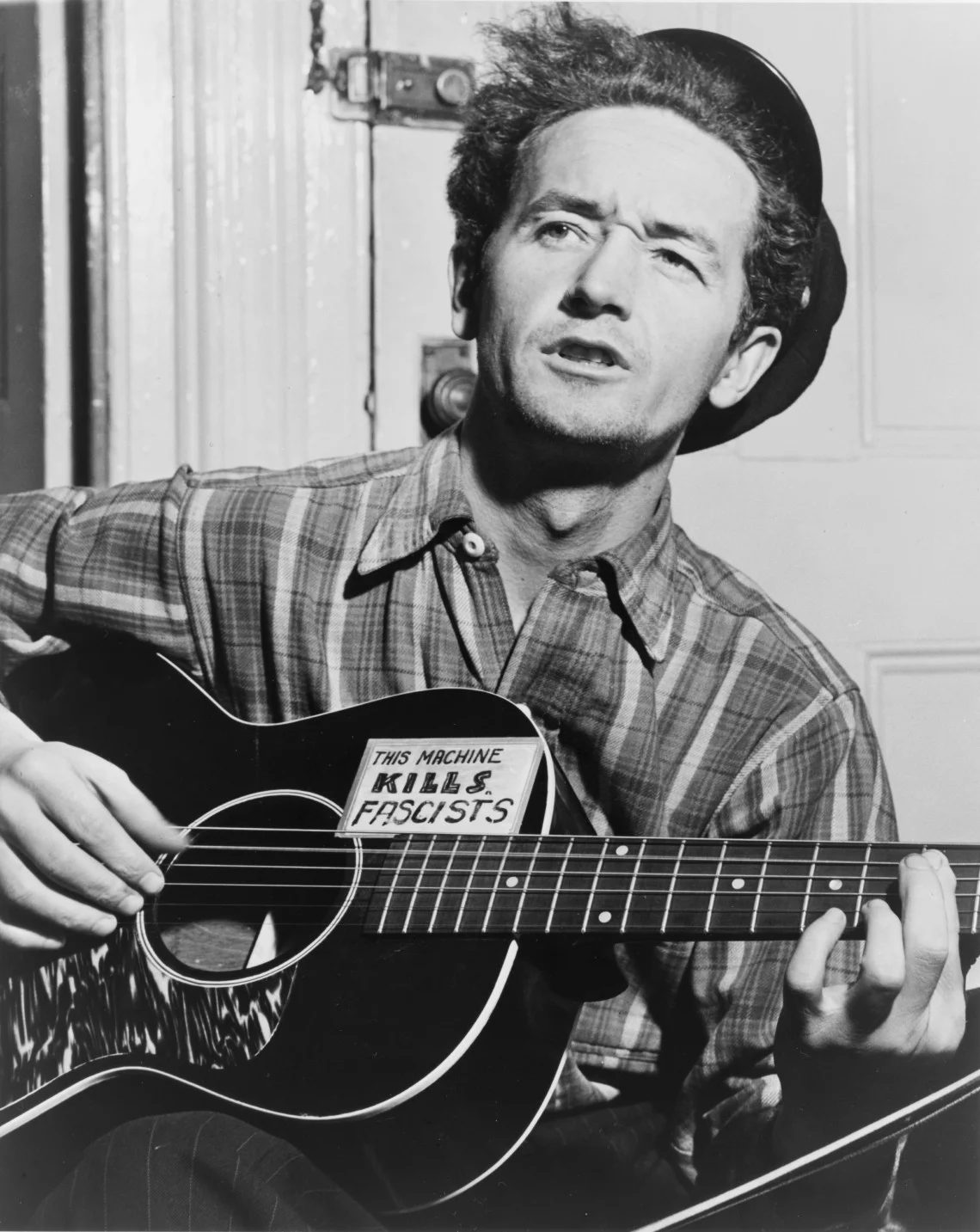 Woody Guthrie's guitar. A special machine.