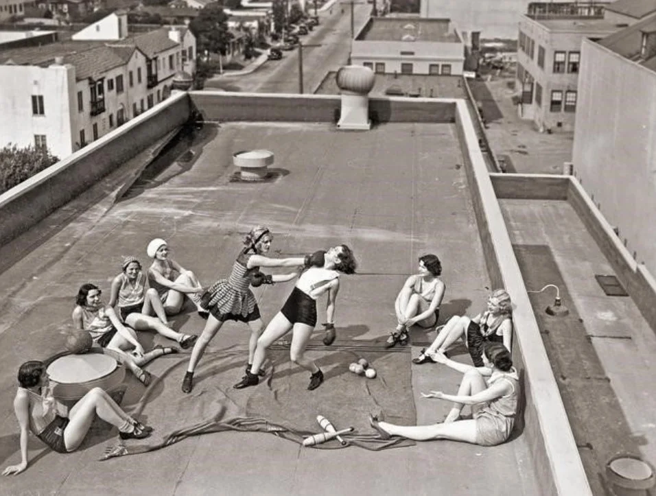 Female boxers train in secret on a roof, 1930s