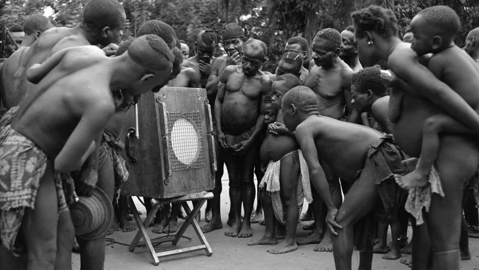 Mbuti pygmies listening back to their own music in 1952