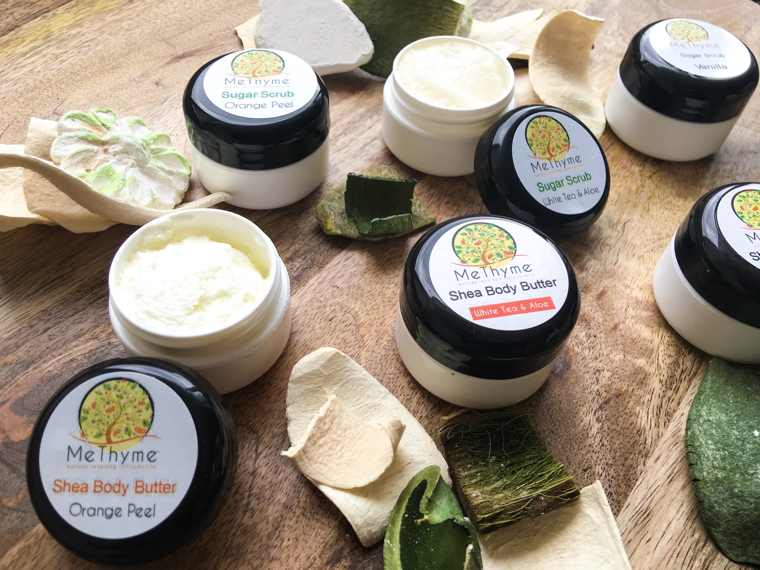 Me Thyme Orange Peel Sugar Scrub & Shea Body Butter/Me Thyme White Tea & Aloe Sugar Scrub & Shea Body Butter/Me Thyme Vanilla Sugar Scrub & Shea Body Butter. Not Pictured: Me Thyme Vanilla Shea Butter Soap & Vanilla Shea Butter Lotion